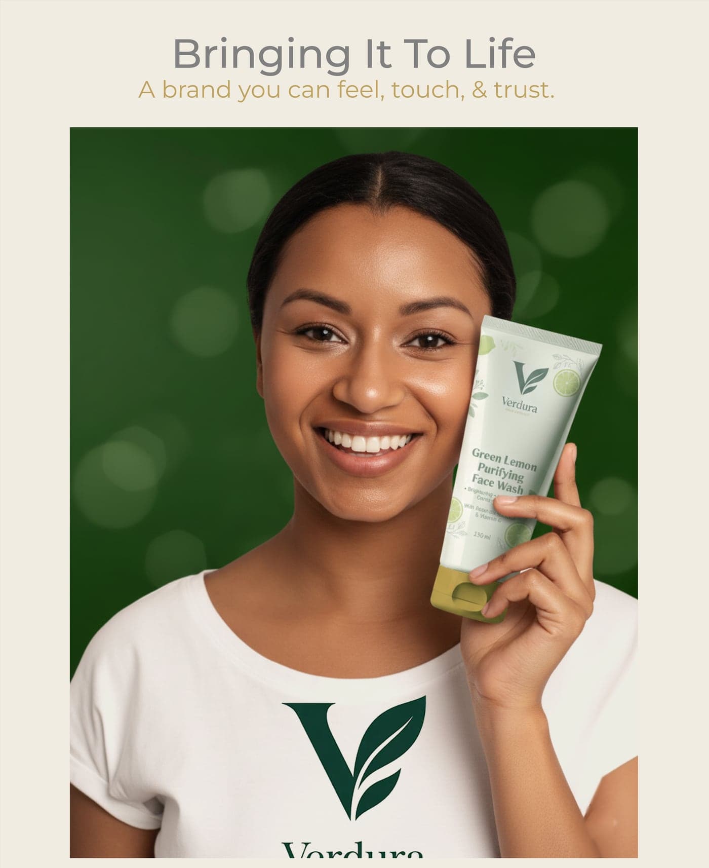 A model in a branded Verdura t-shirt holding the Green Lemon Purifying Face Wash